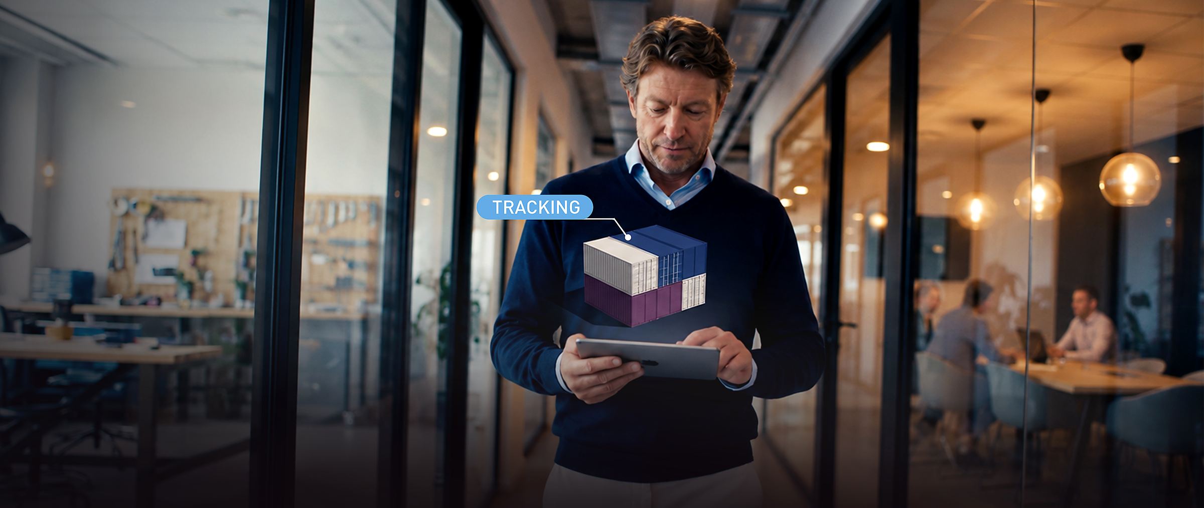Executive tracking a shipment on a tablet, cargo visualised above the screen